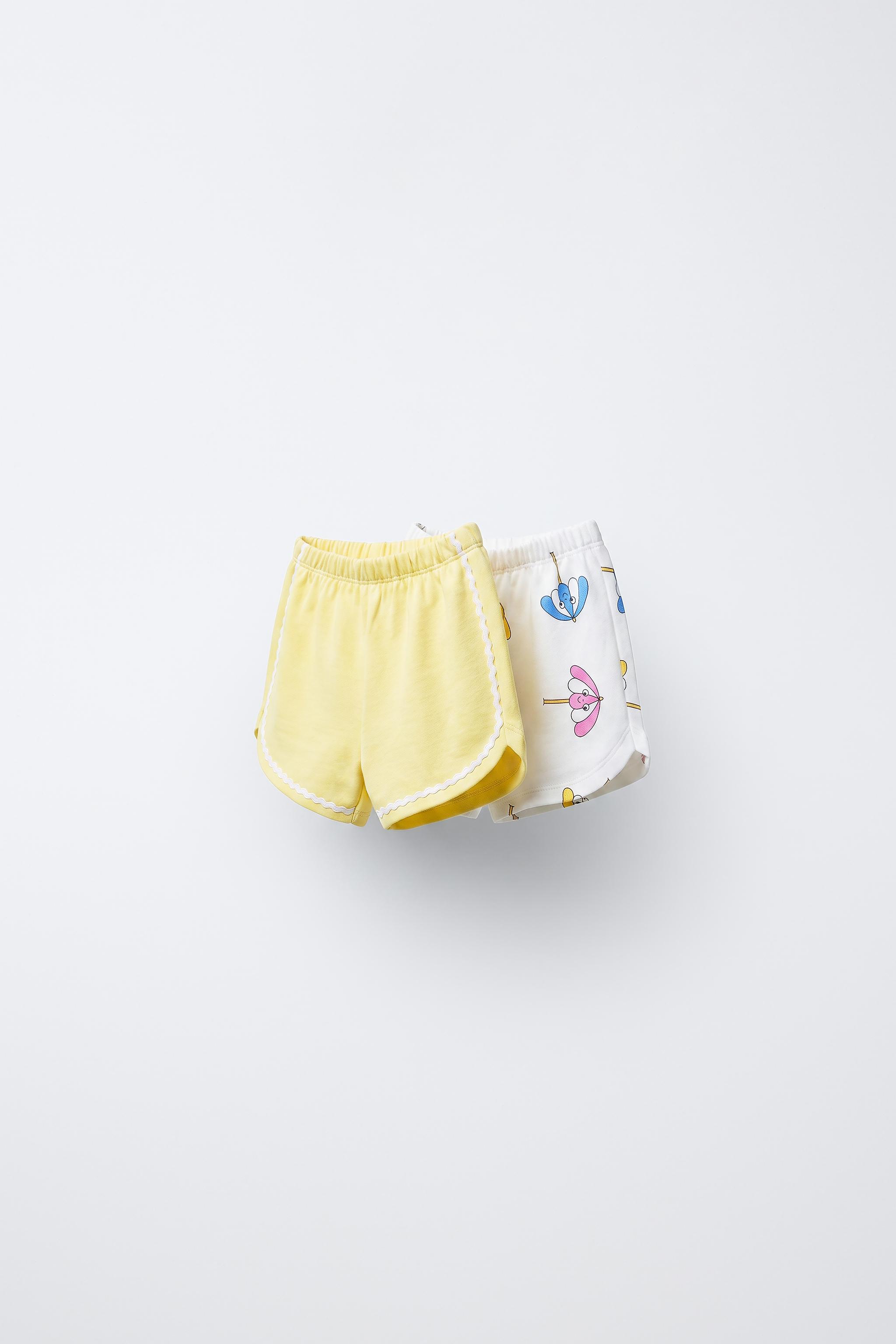 LOT DE DEUX SHORTS EN MOLLETON PARAPLUIES PLAGE ET ONDULINE